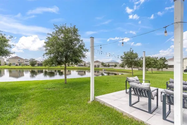 a view of a lake with houses in the background