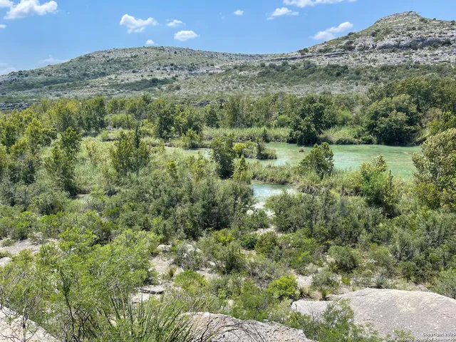 a view of a field of mountains and valleys