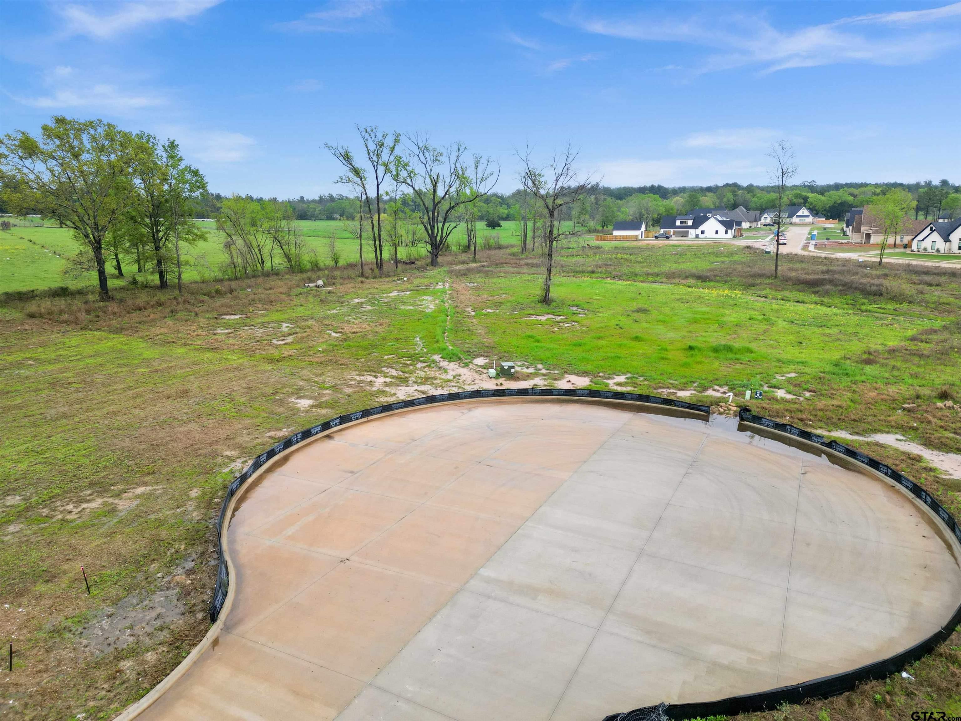 12015 Cedar Circle Flint, TX 75762 - Photo 5 of 14 a view of a swimming pool with a yard