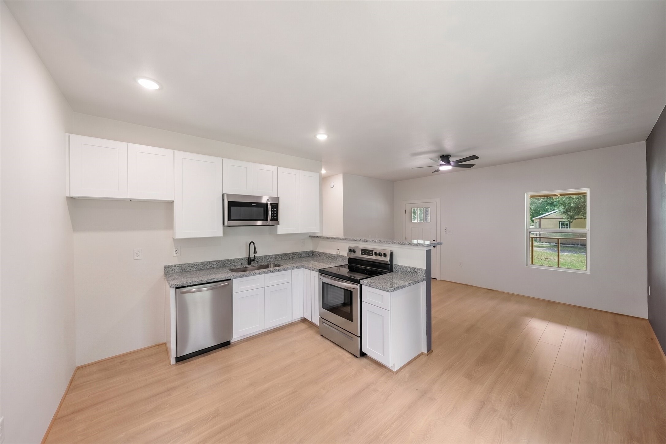 136 Ash Street Trinity, TX 75862 - Photo 8 of 31 a kitchen with a sink and steel appliances