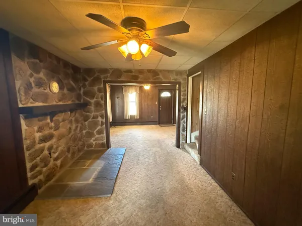 a kitchen with stainless steel appliances kitchen island granite countertop a stove and a sink