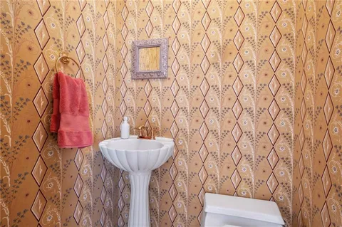 a bathroom with a sink and toilet