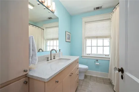 a bathroom with a sink toilet and a tub