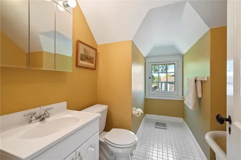 a bathroom with a sink toilet tub and shower