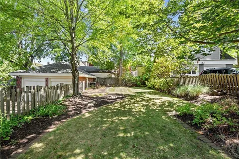 a backyard of a house with lots of green space