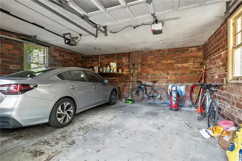 a view of parking garage with cars
