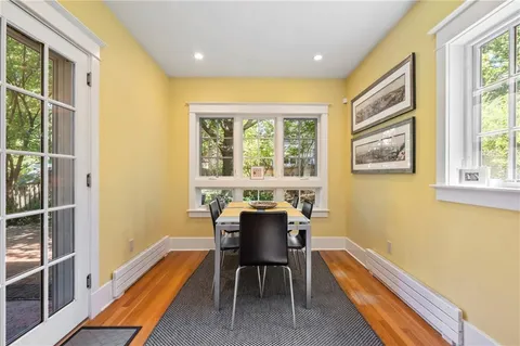 a dining room with furniture and windows