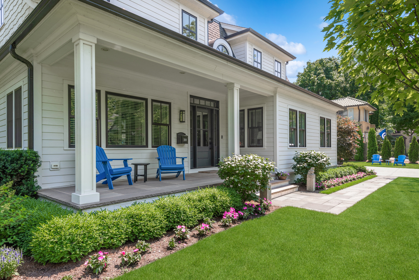 209 Fuller Lane Winnetka, IL 60093 - Photo 2 of 9 a view of a house with porch and garden