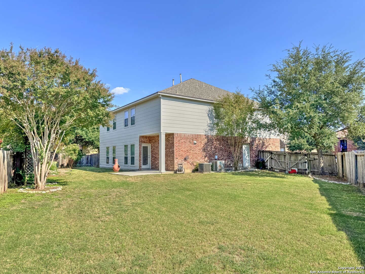 8711 Sandia Circle Helotes, TX 78023 - Photo 37 of 40 a view of a house with a big yard and large trees
