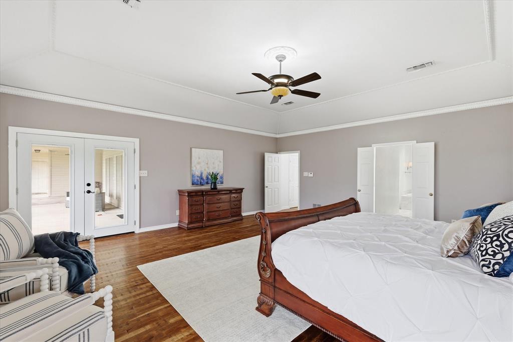 6955 Hawk Road Flower Mound, TX 75022 - Photo 22 of 40 Tray ceiling with crown molding and recessed lighting