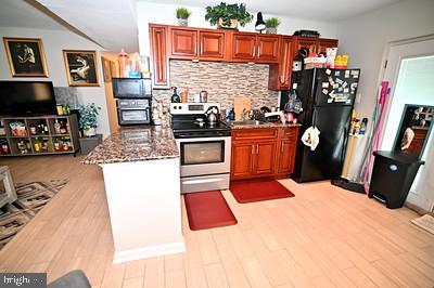 11802 Flora Lane Bowie, MD 20721 - Photo 22 of 26 Kitchen with granite lower level
