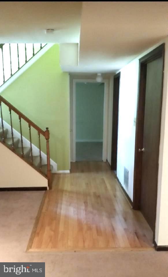 11802 Flora Lane Bowie, MD 20721 - Photo 4 of 26 Stairs leading to basement still exist behind wall