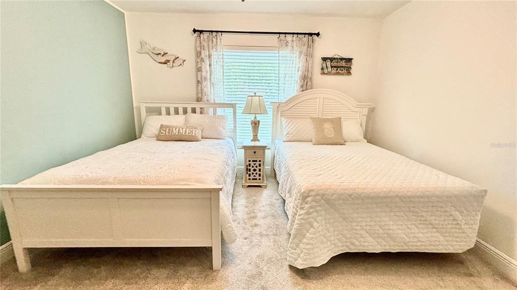 912 72nd Street Northwest Bradenton, FL 34209 - Photo 19 of 25 a bedroom with a bed and a table