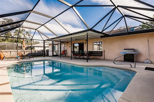 a view of a swimming pool with a patio