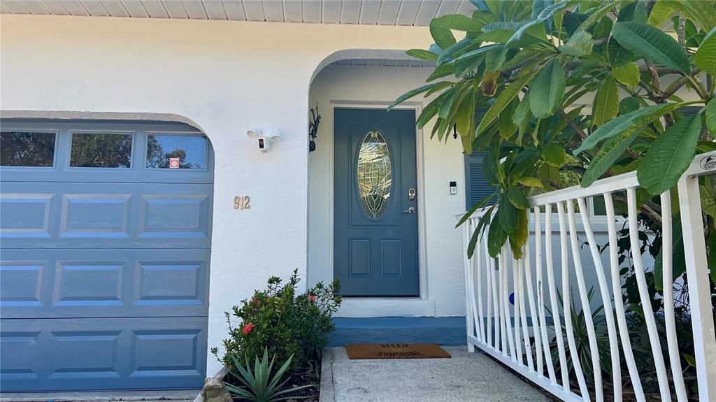 912 72nd Street Northwest Bradenton, FL 34209 - Photo 22 of 25 a view of front door and potted plants