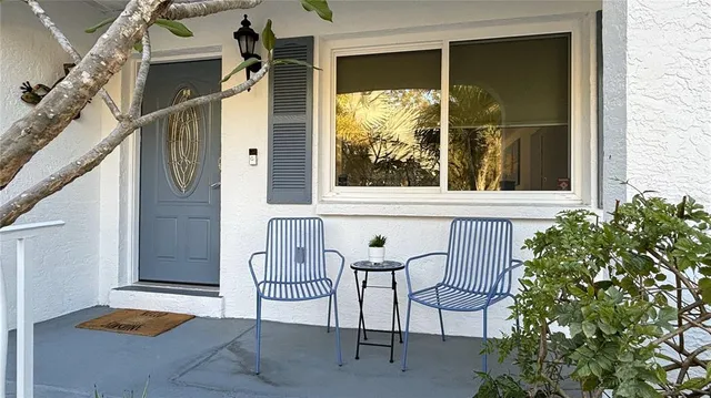 a view of a door and chair and door