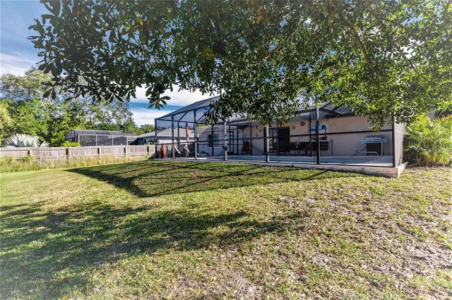 a house view with swimming pool in front of it