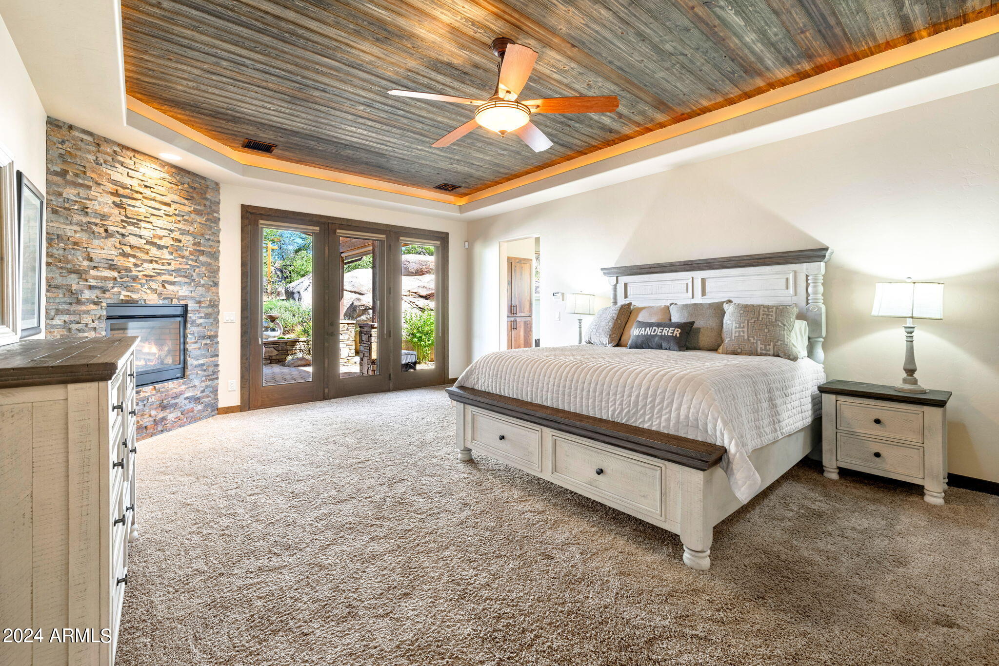 1398 Ridgewood Drive Prescott, AZ 86305 - Photo 15 of 34 a spacious bedroom with a large bed and a large window