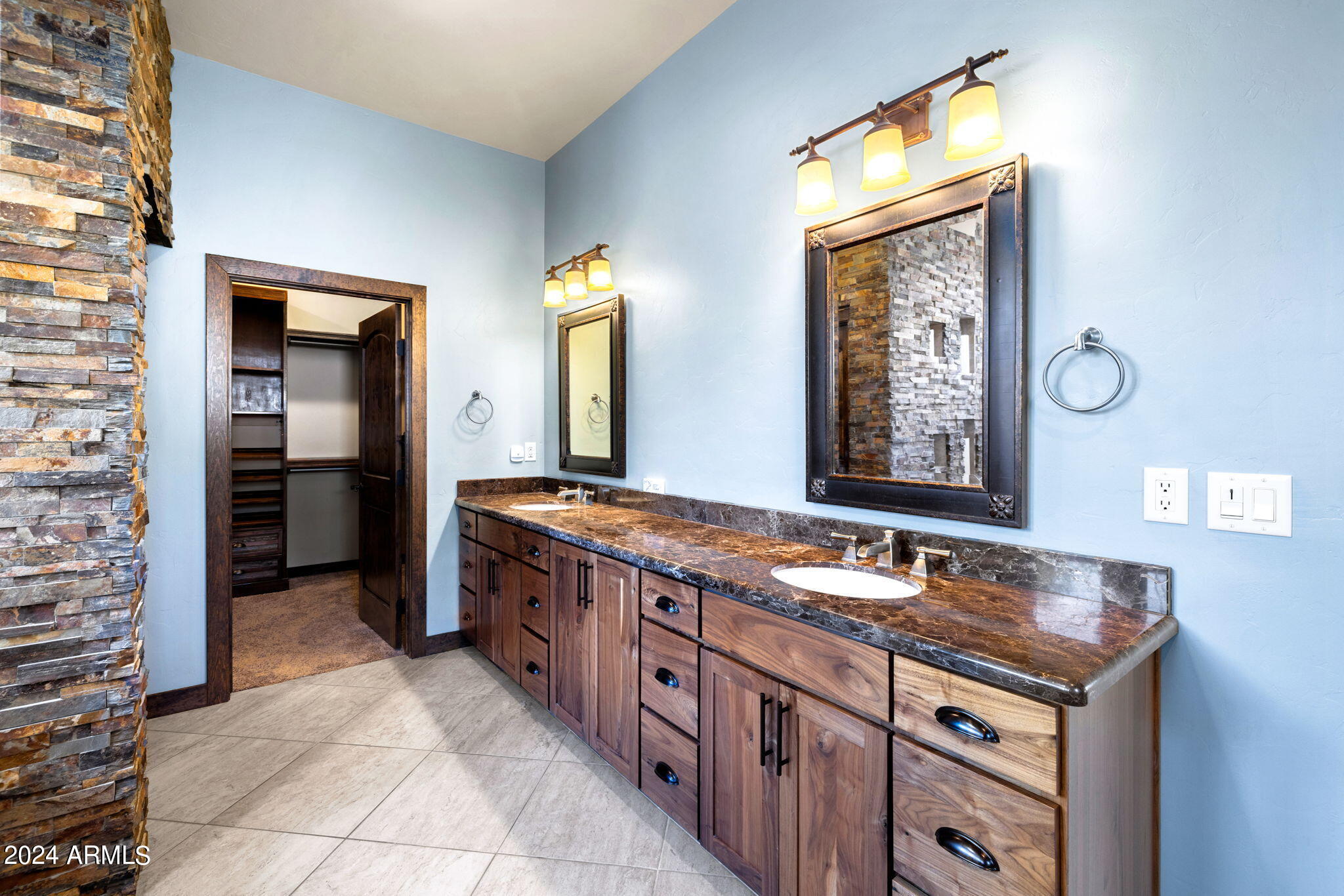1398 Ridgewood Drive Prescott, AZ 86305 - Photo 19 of 34 a spacious bathroom with a granite countertop sink and a mirror