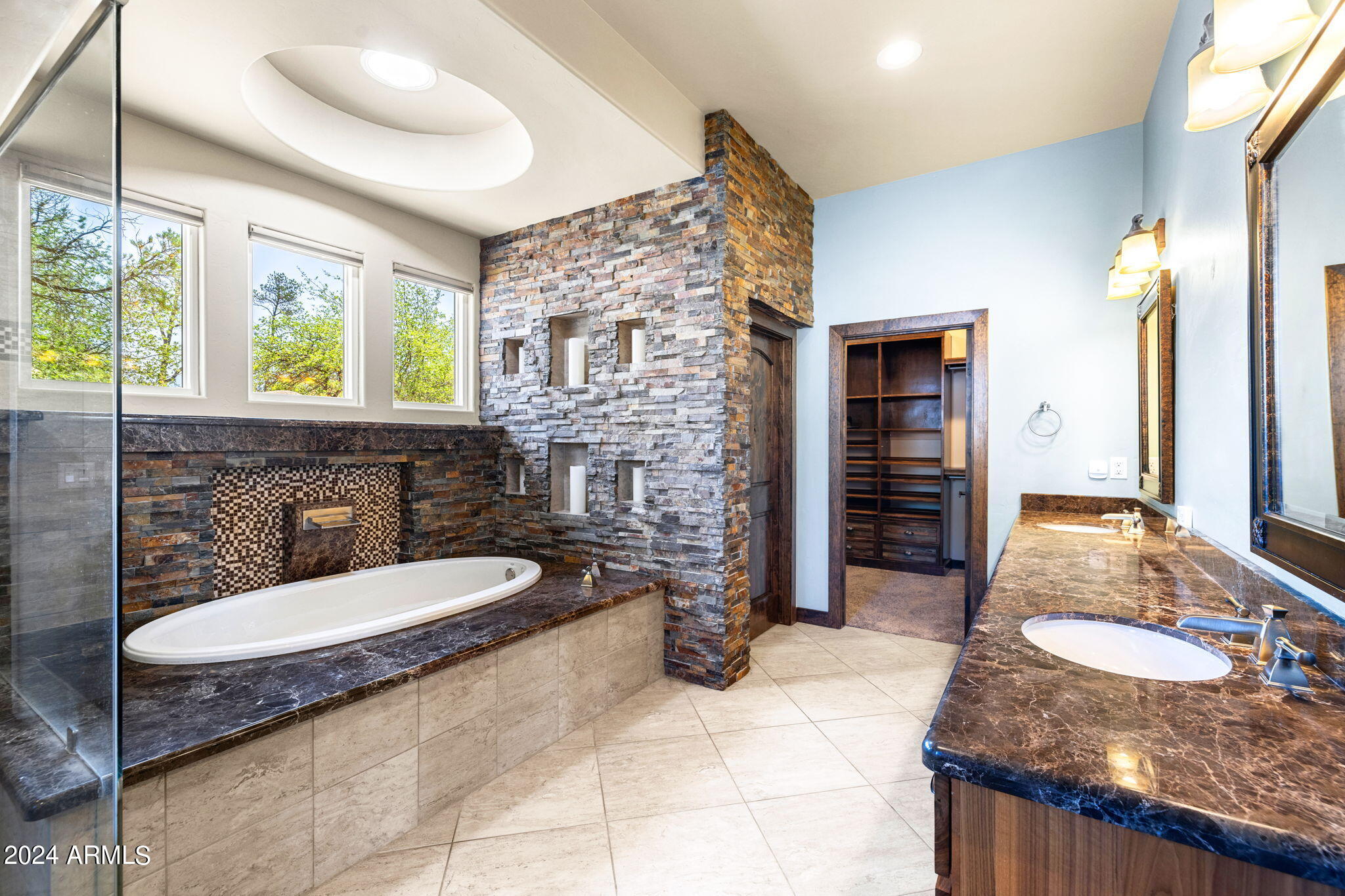 1398 Ridgewood Drive Prescott, AZ 86305 - Photo 20 of 34 a bathroom with a granite countertop sink a toilet and shower