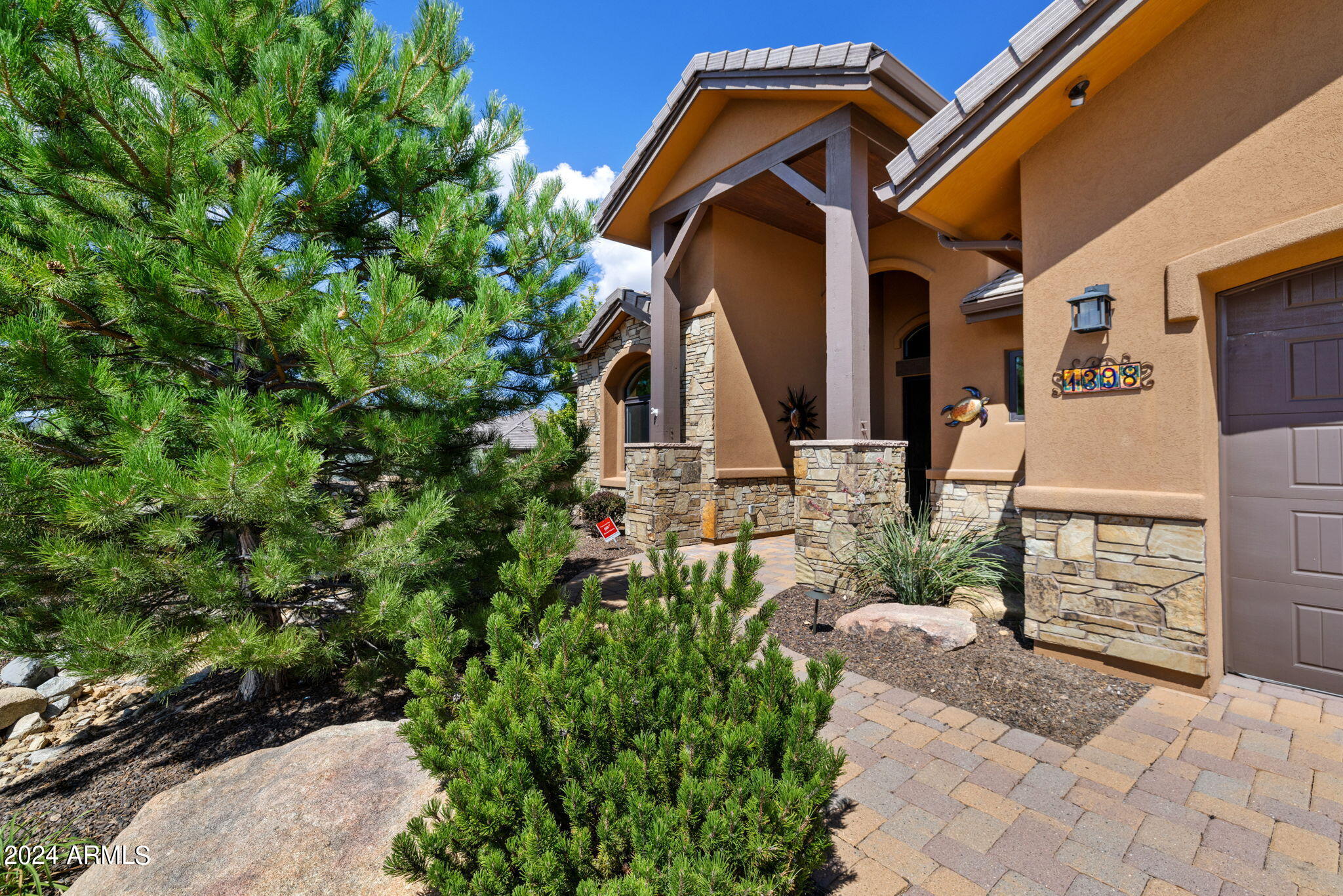 1398 Ridgewood Drive Prescott, AZ 86305 - Photo 4 of 34 a front view of a house with a yard