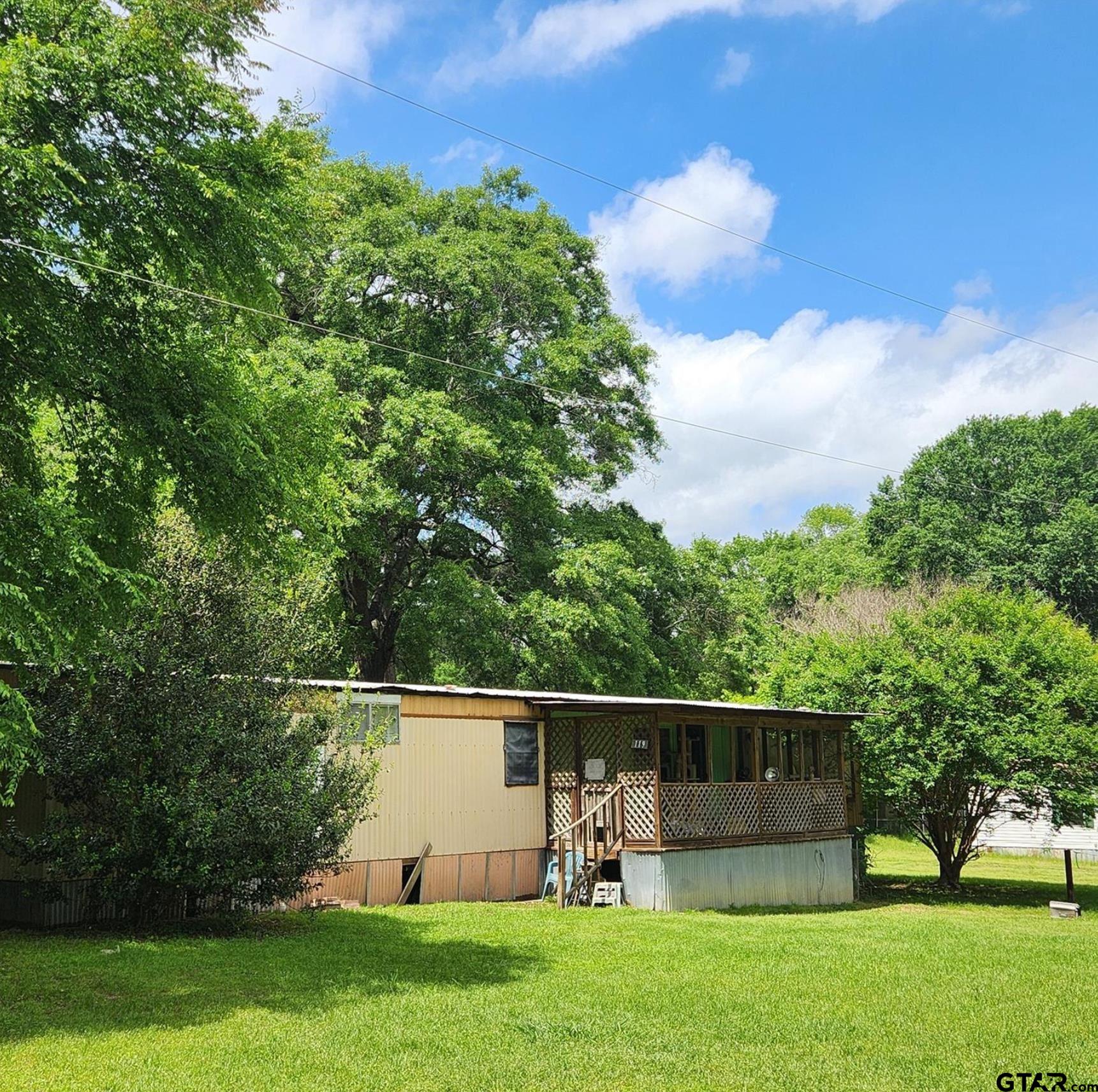 109 Falcon Spur Carthage, TX 75633 - Photo 8 of 13 a view of a garden