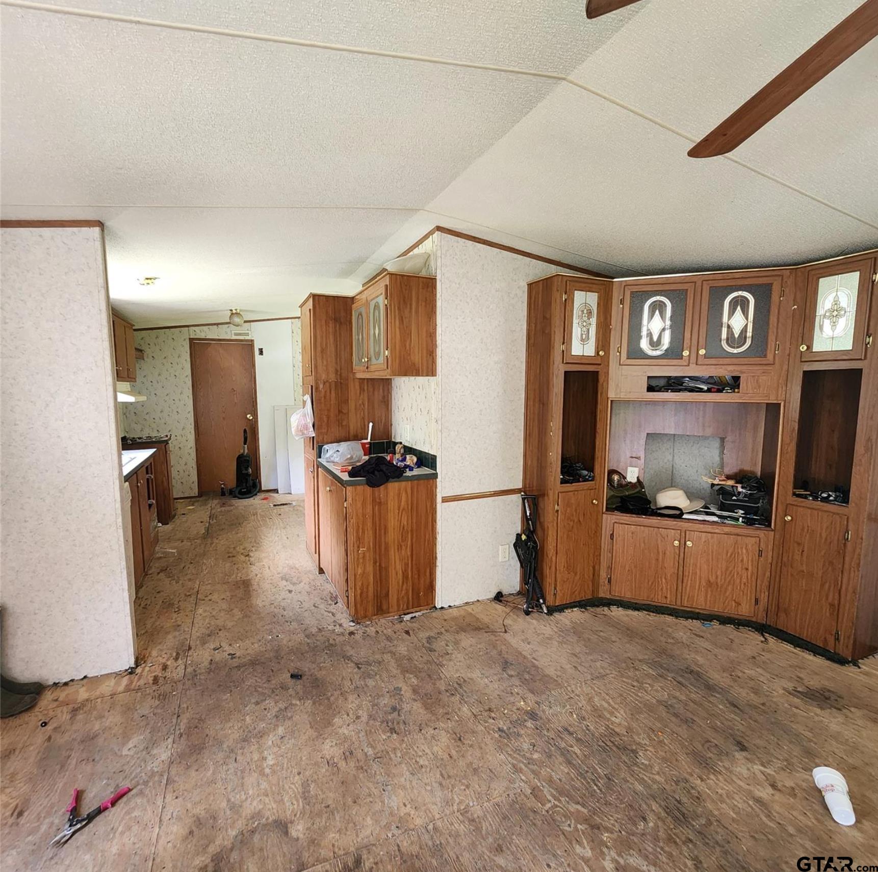 109 Falcon Spur Carthage, TX 75633 - Photo 10 of 13 a view of a kitchen with refrigerator and windows