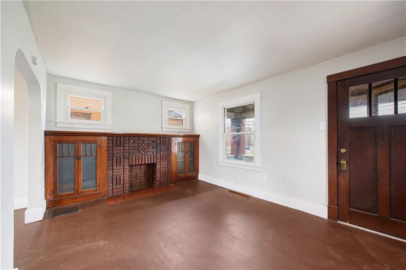 414 Virginia Avenue Rochester, PA 15074 - Photo 3 of 22 an empty room with windows and fireplace