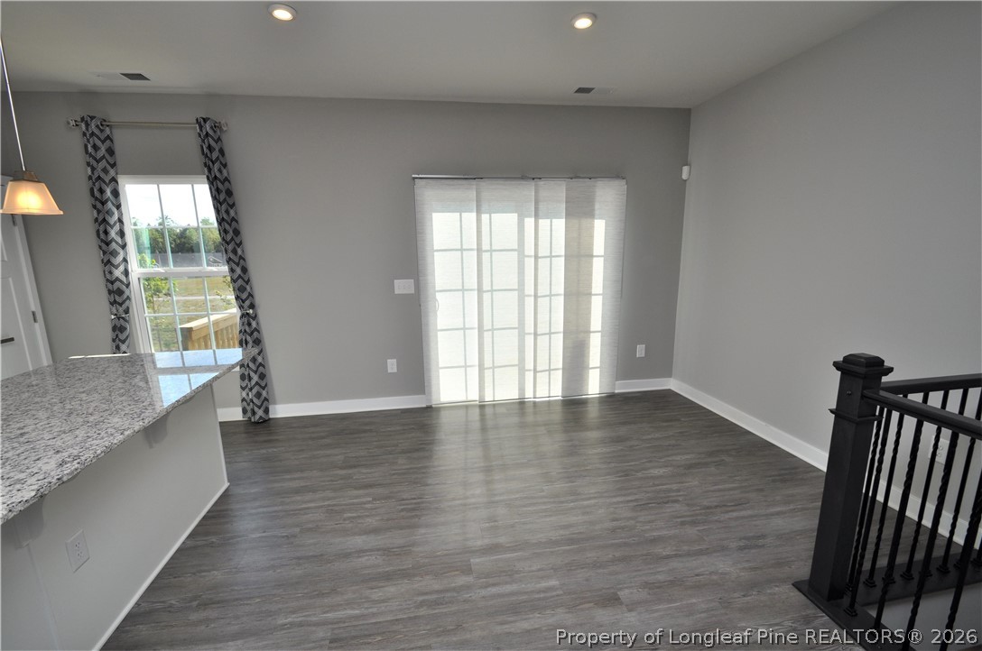 200 Misty Pike Drive Raleigh, NC 27603 - Photo 17 of 49 a view of an empty room with glass door and wooden floor