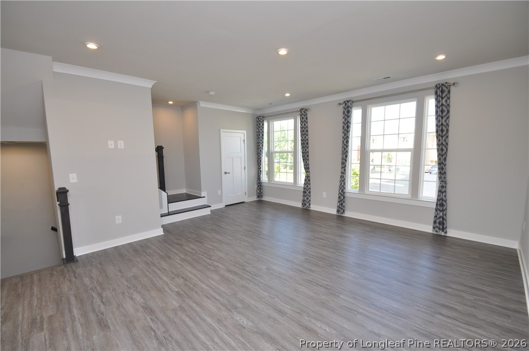 200 Misty Pike Drive Raleigh, NC 27603 - Photo 20 of 49 a view of an empty room with wooden floor and a window