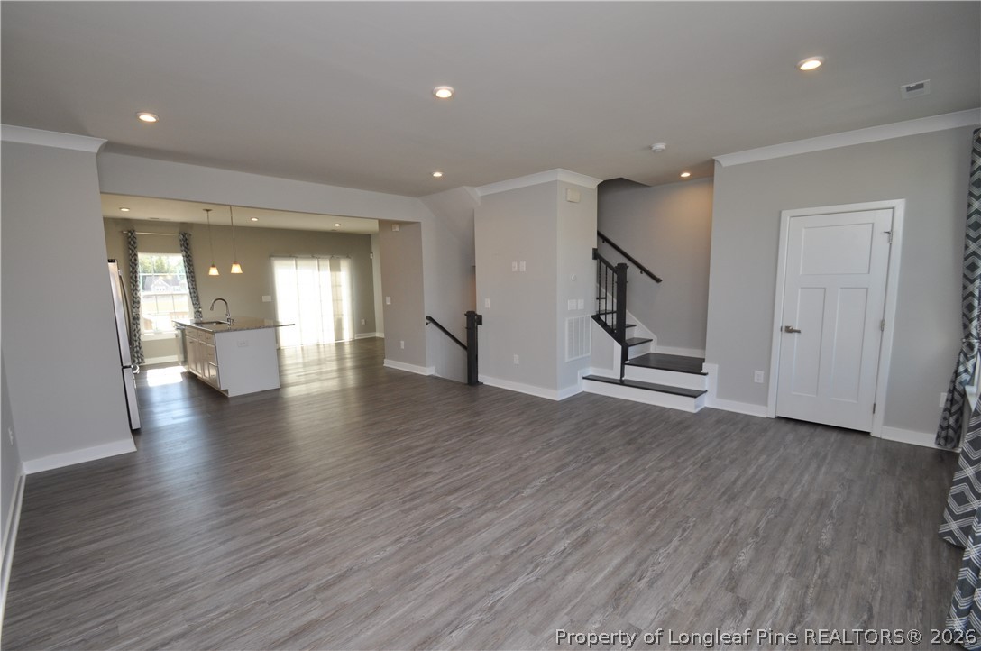 200 Misty Pike Drive Raleigh, NC 27603 - Photo 21 of 49 an empty room with wooden floor and windows