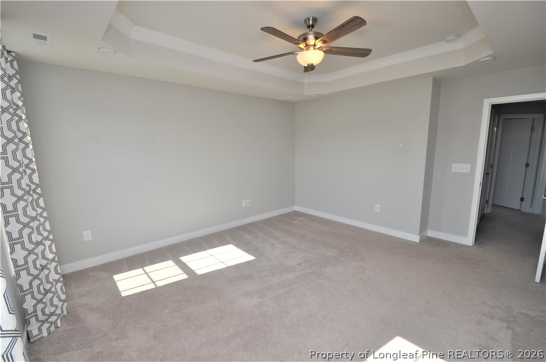 200 Misty Pike Drive Raleigh, NC 27603 - Photo 28 of 49 an empty room with a window and a ceiling fan