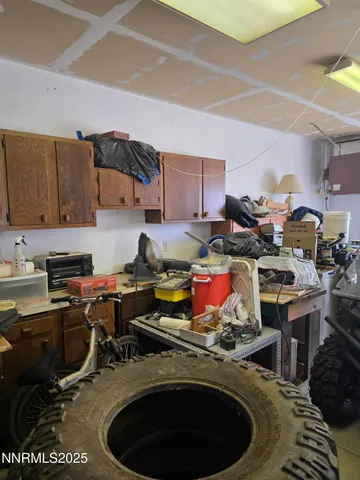 a bathroom with a refrigerator and a sink
