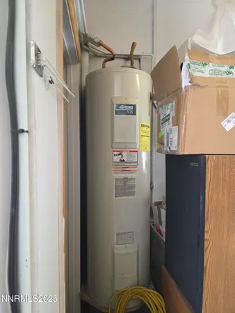 a bedroom with a bed and a tv