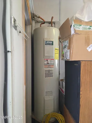 a bedroom with a bed and a tv