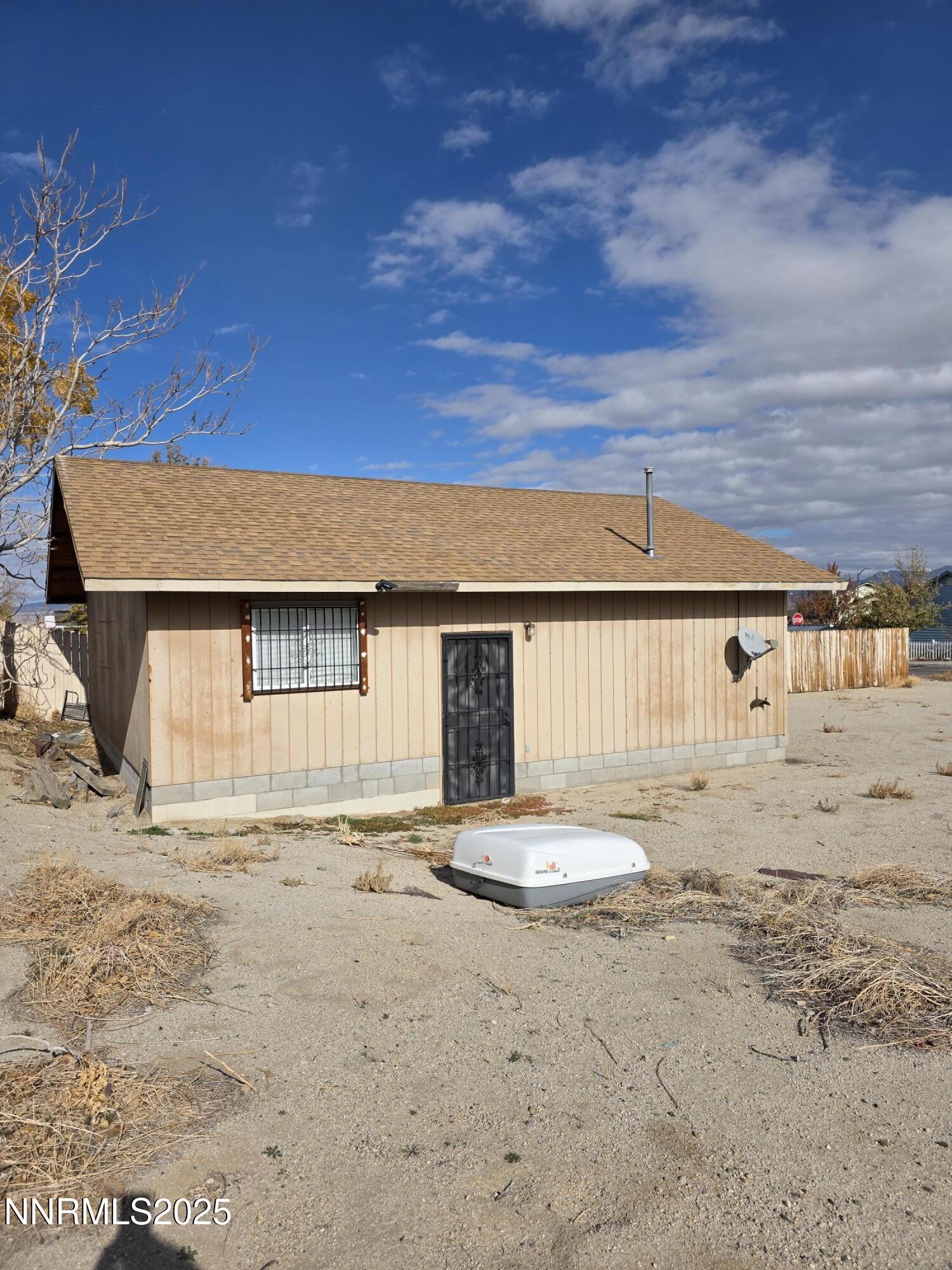 215 Cedar Street Hawthorne, NV 89415 - Photo 5 of 19 a front view of a house with a yard