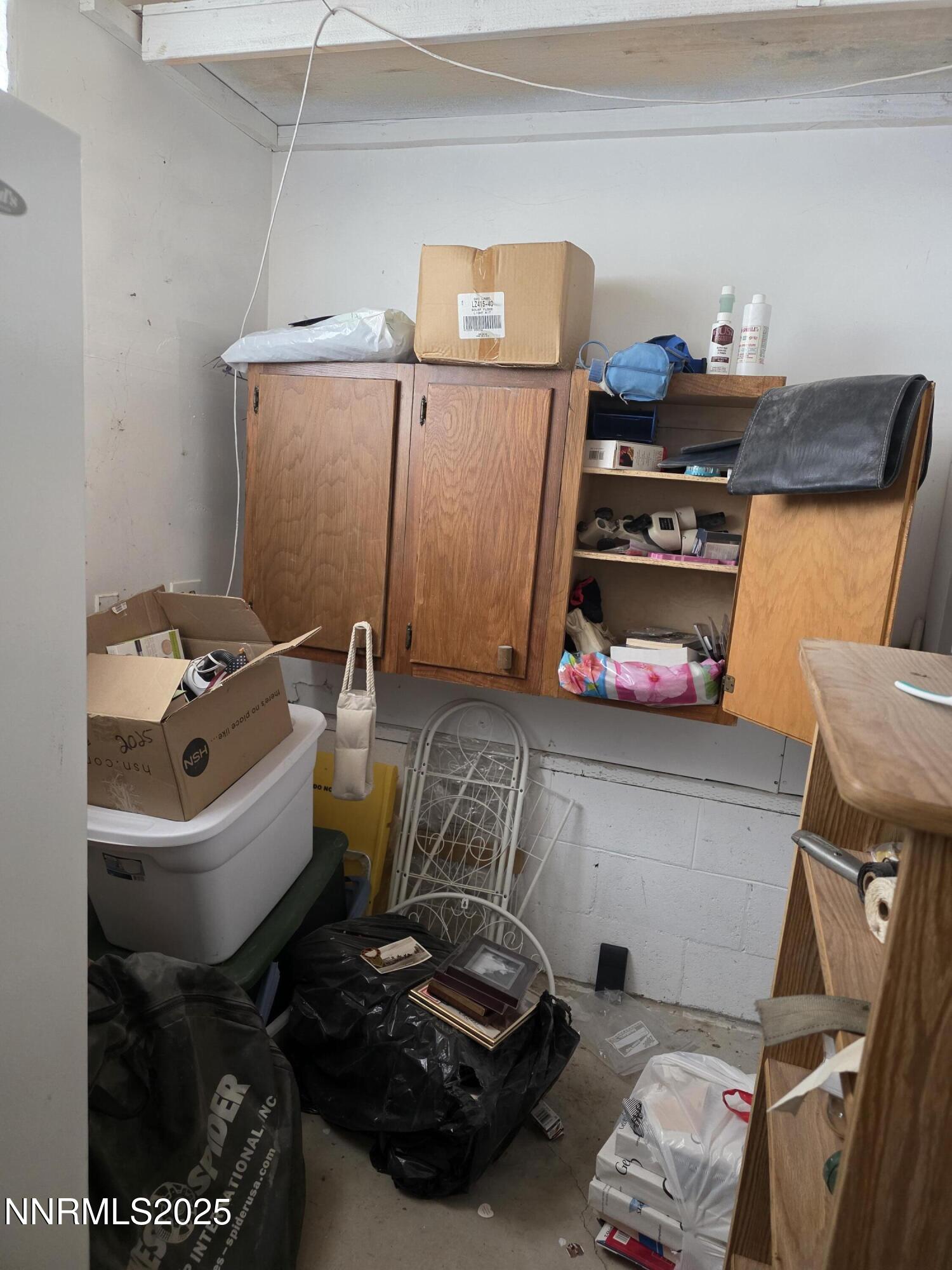 215 Cedar Street Hawthorne, NV 89415 - Photo 9 of 19 a room with storage and utility