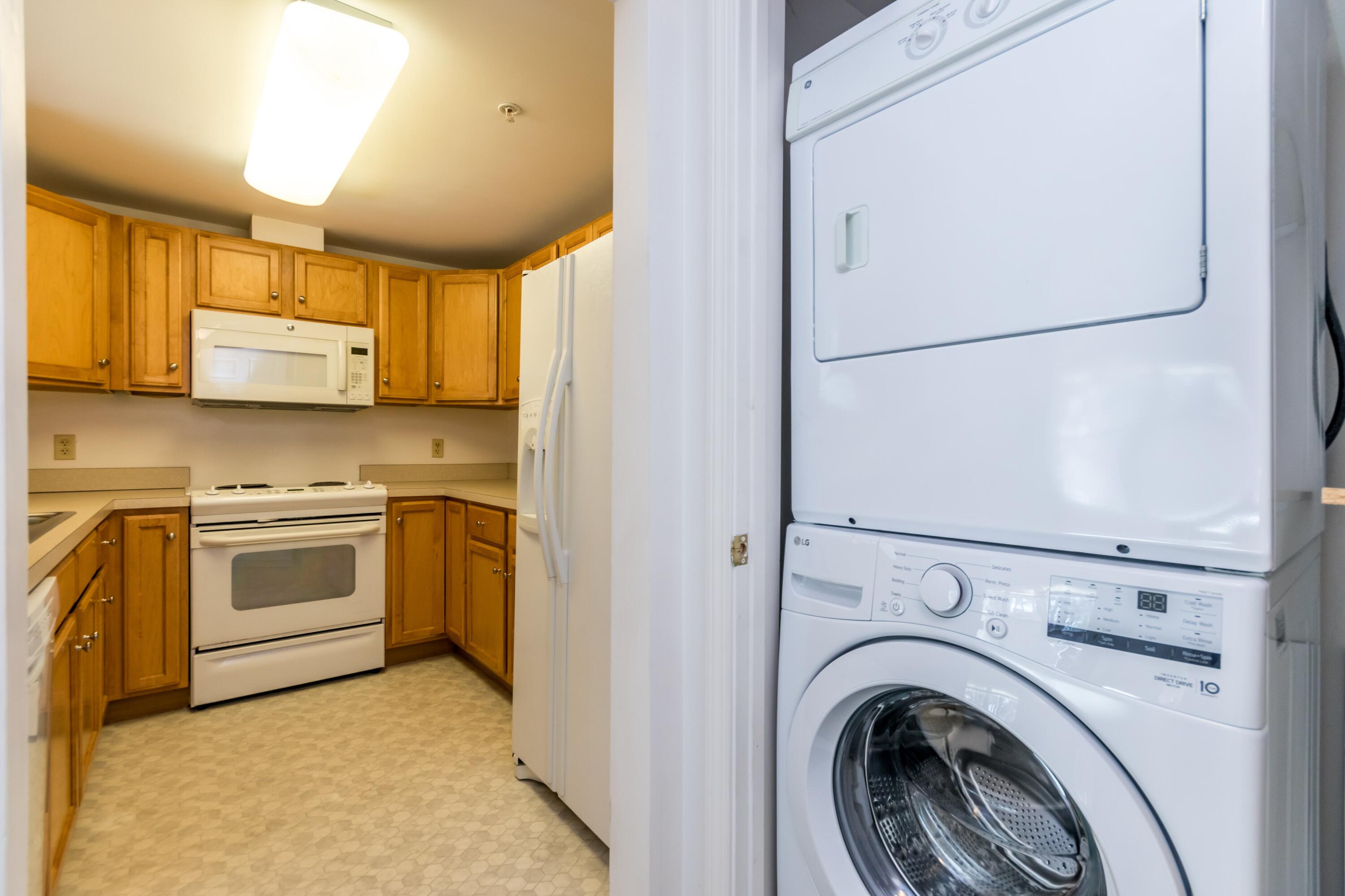 18 West Road, Unit 216 Orleans, MA 02653 - Photo 8 of 39 Washer/dryer next to kitchen