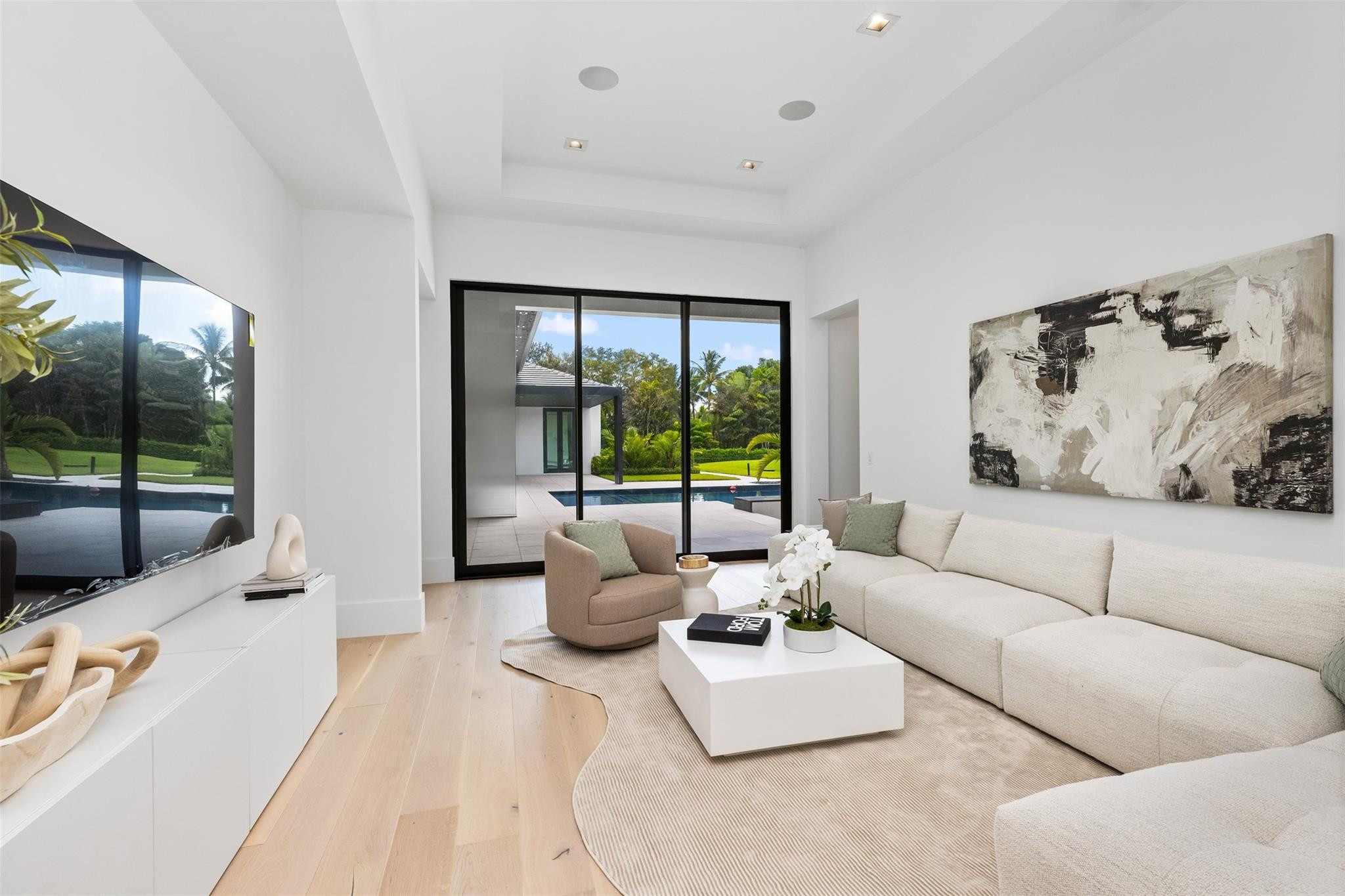 12701 Luray Road Southwest Ranches, FL 33330 - Photo 13 of 44 a living room with furniture and a flat screen tv
