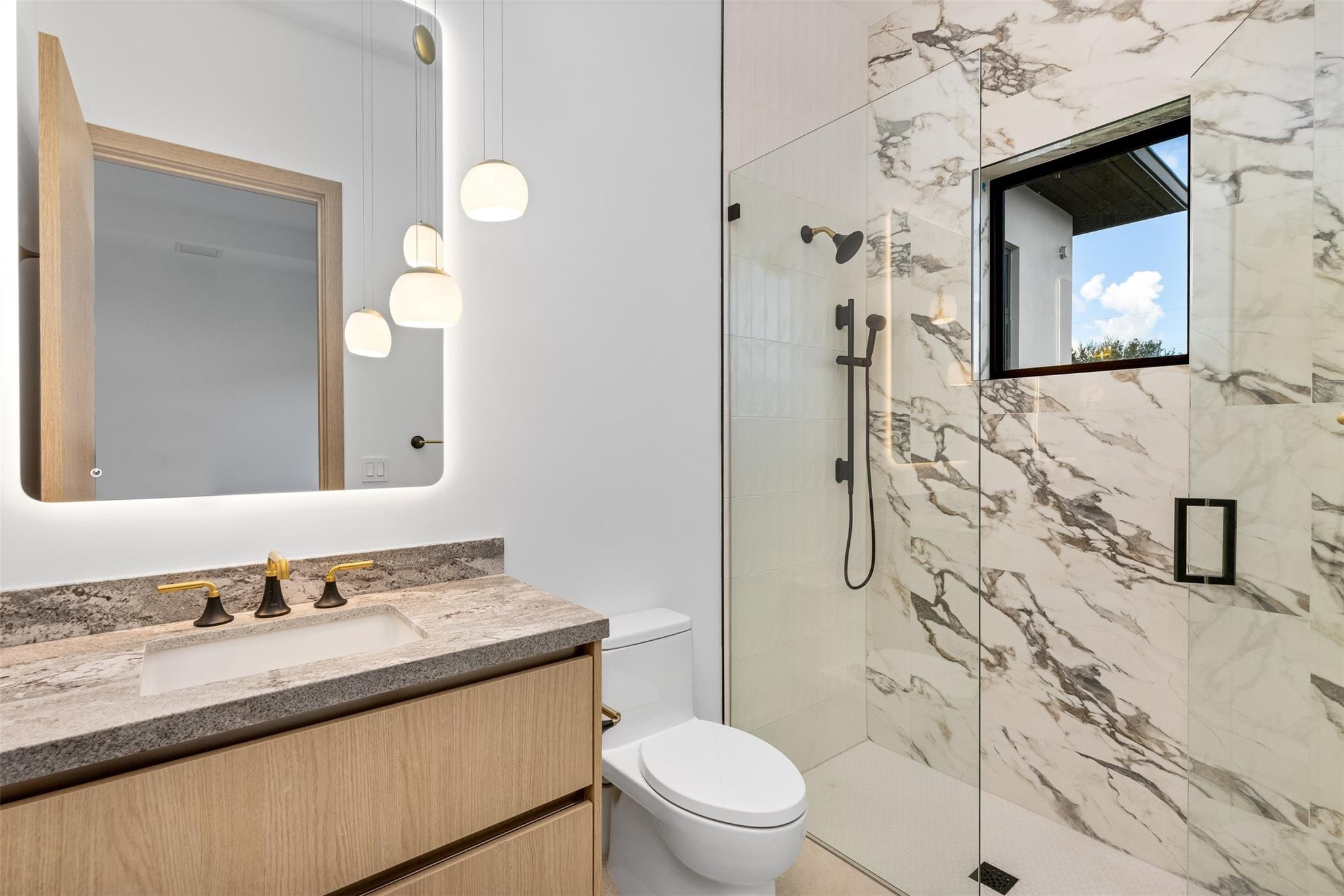 12701 Luray Road Southwest Ranches, FL 33330 - Photo 25 of 44 a bathroom with a granite countertop toilet sink and mirror