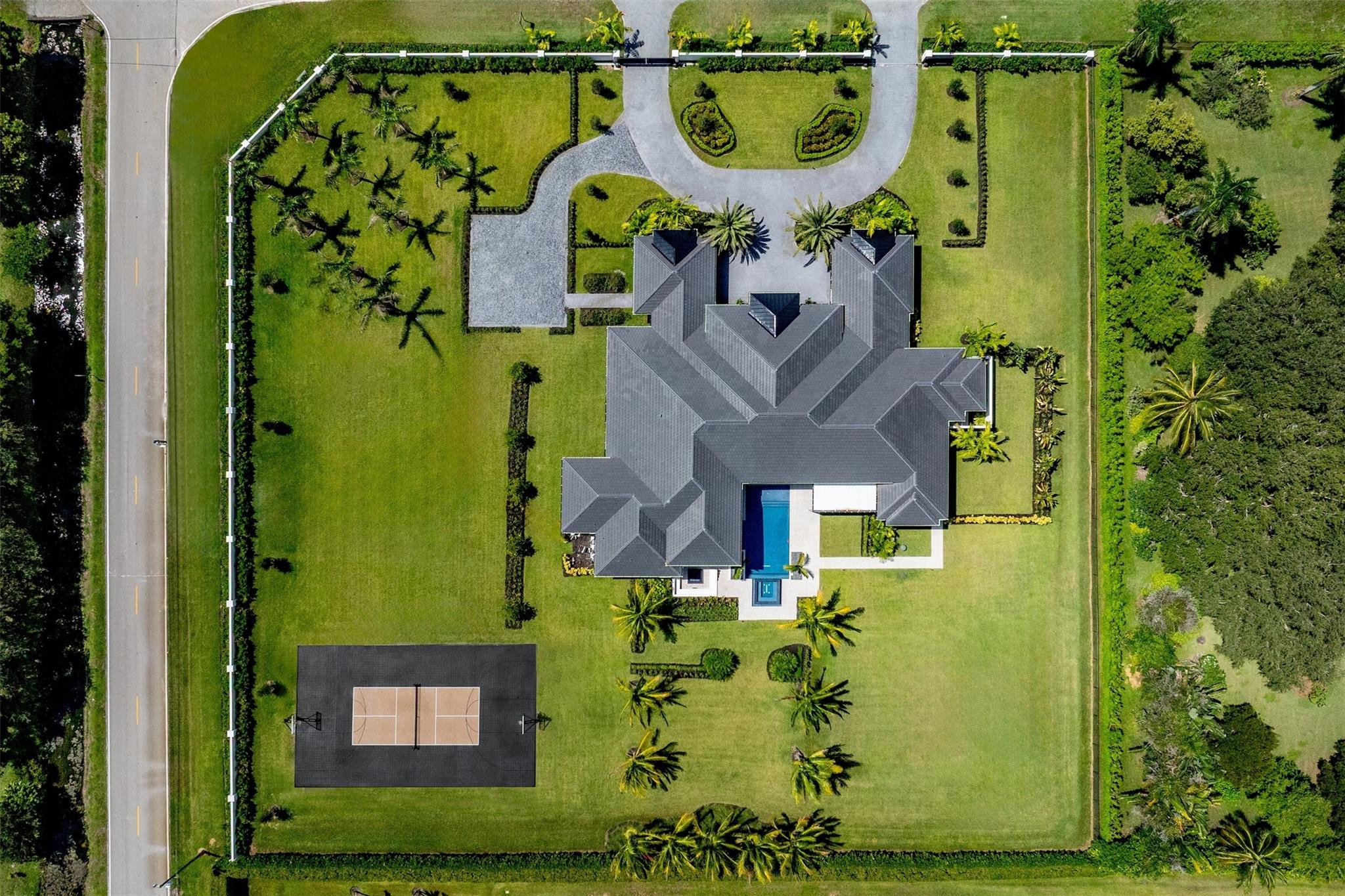 12701 Luray Road Southwest Ranches, FL 33330 - Photo 29 of 44 an aerial view of a house with a swimming pool