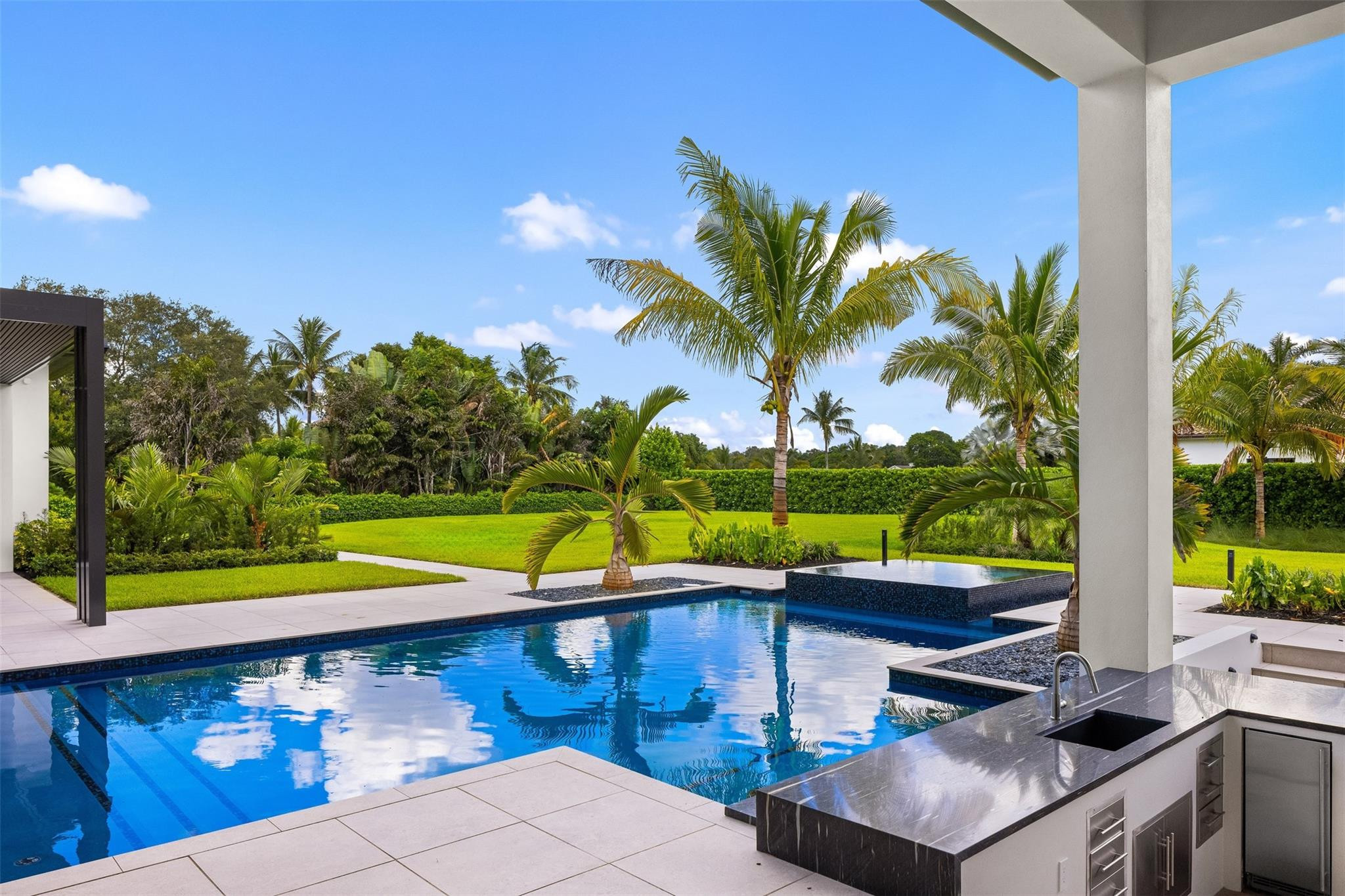 12701 Luray Road Southwest Ranches, FL 33330 - Photo 30 of 44 a view of swimming pool with a patio