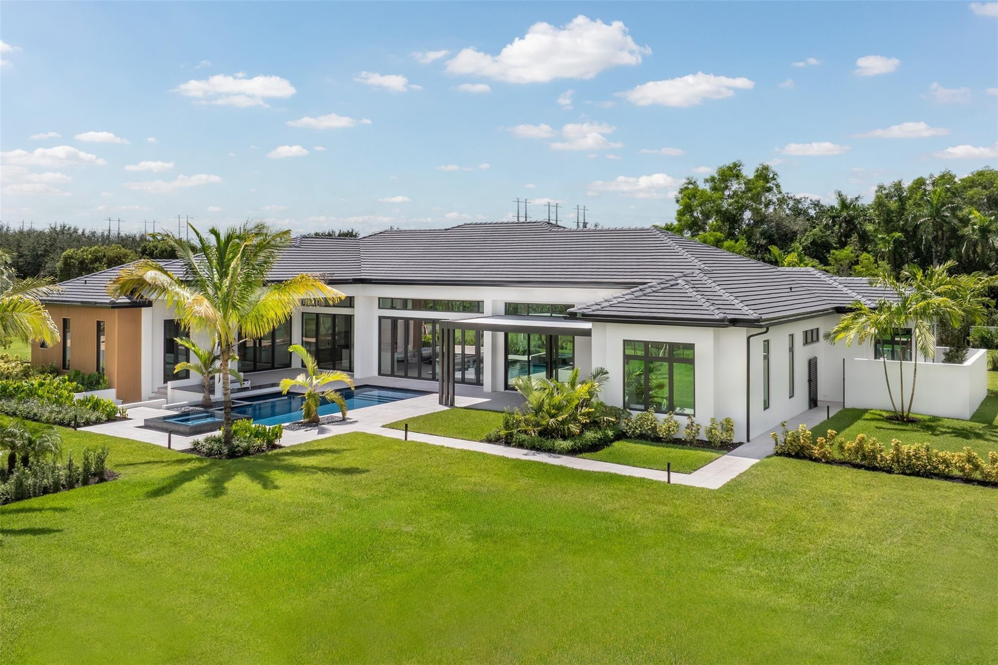 12701 Luray Road Southwest Ranches, FL 33330 - Photo 43 of 44 a view of a house with swimming pool and sitting area