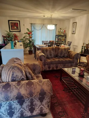 a living room with furniture and a couch