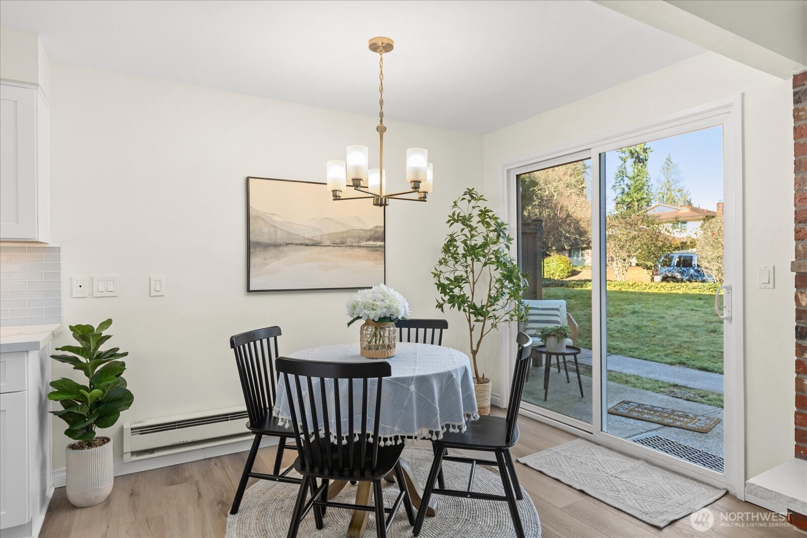 410 214th Street Southwest, Unit B Bothell, WA 98021 - Photo 11 of 37 a view of a dining room with furniture window and wooden floor