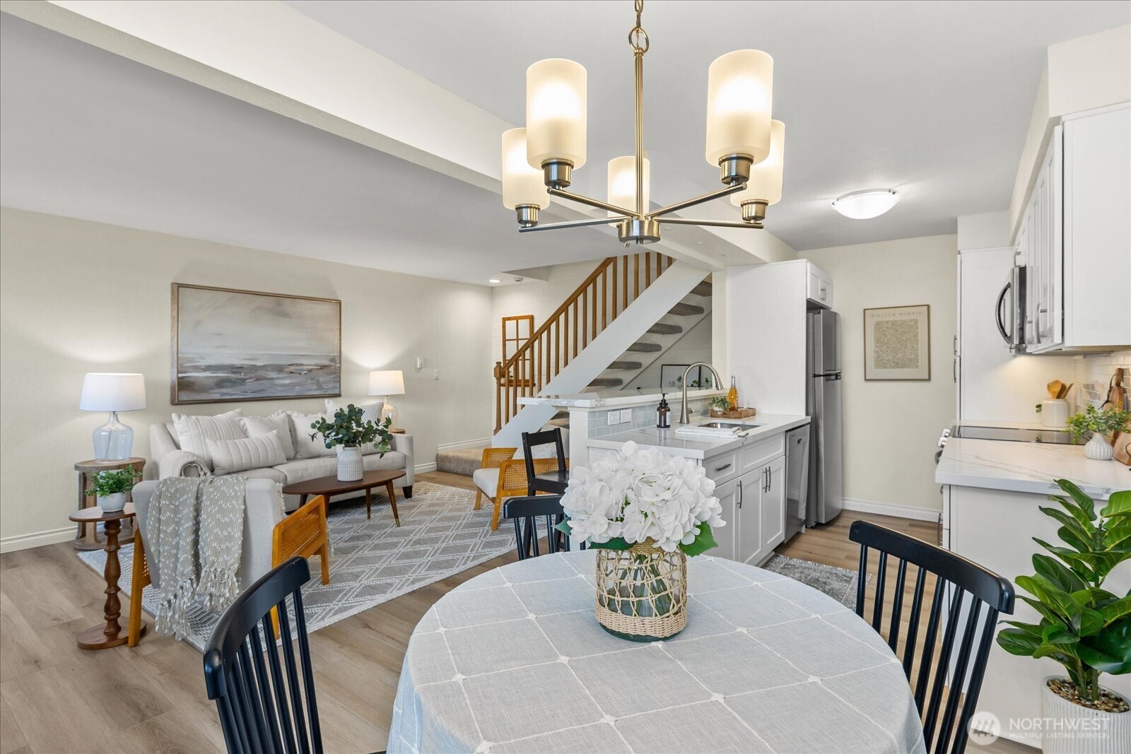 410 214th Street Southwest, Unit B Bothell, WA 98021 - Photo 12 of 37 a view of a dining room with furniture and a chandelier