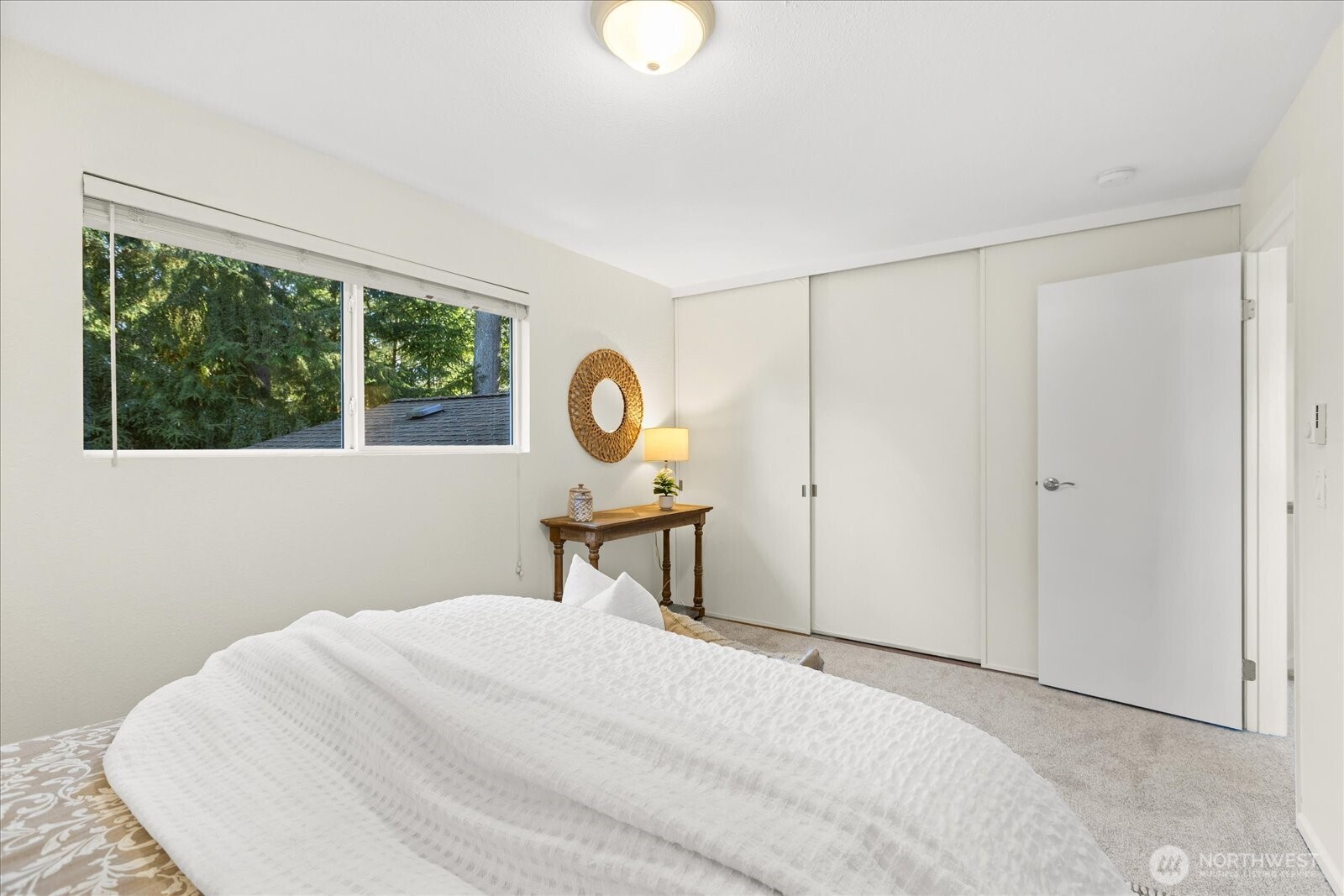 410 214th Street Southwest, Unit B Bothell, WA 98021 - Photo 19 of 37 a bedroom with a bed and a window