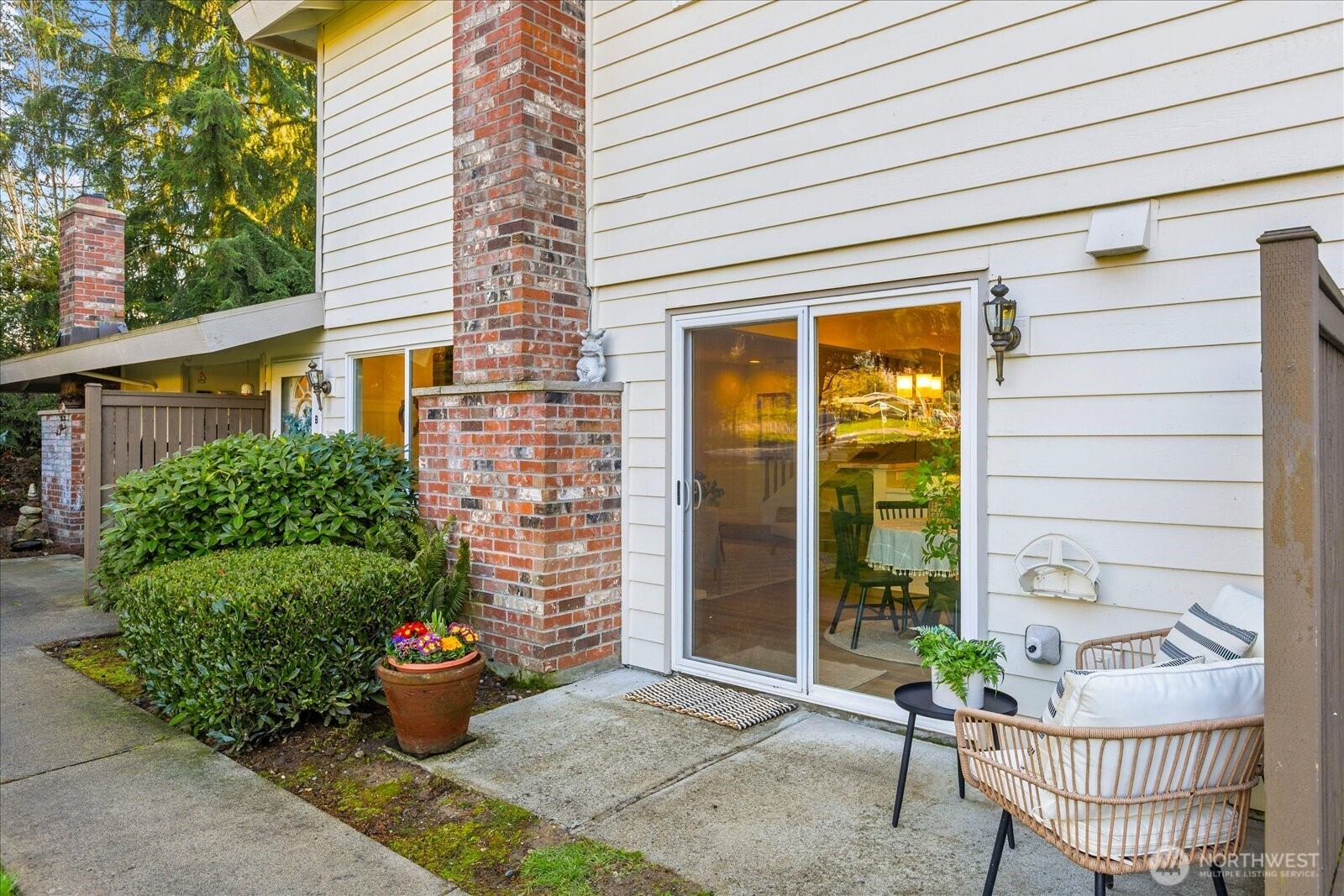 410 214th Street Southwest, Unit B Bothell, WA 98021 - Photo 5 of 37 a view of a chair and table in the porch