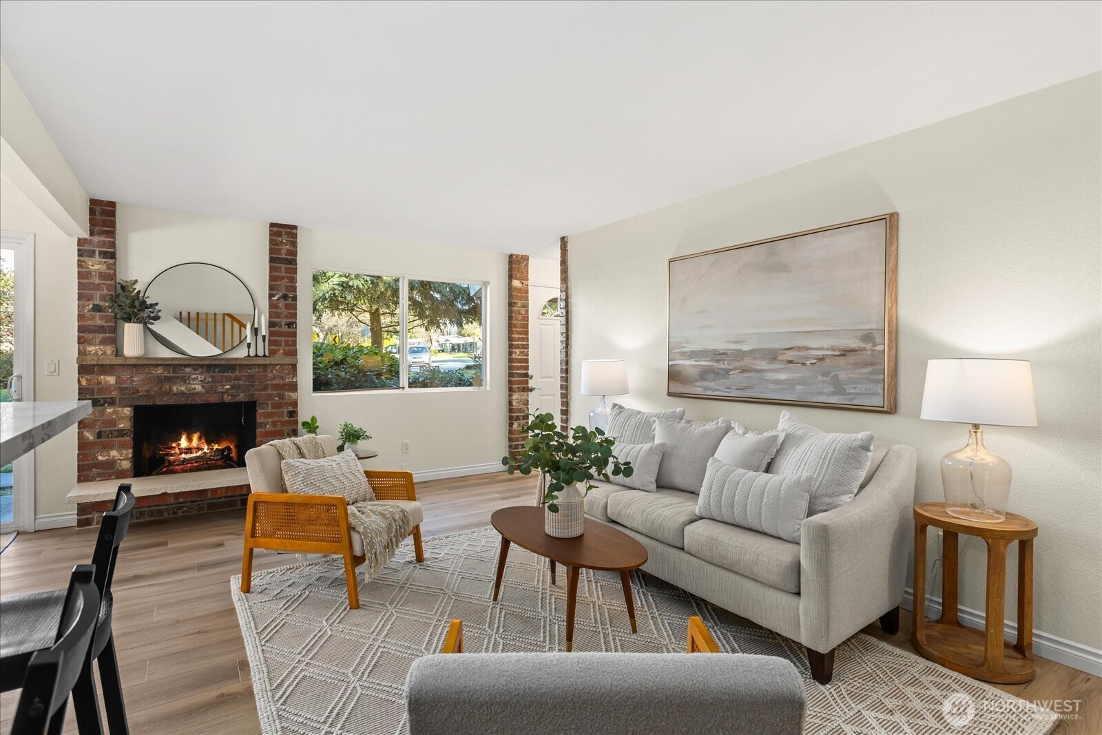 410 214th Street Southwest, Unit B Bothell, WA 98021 - Photo 8 of 37 a living room with furniture a fireplace and a large window