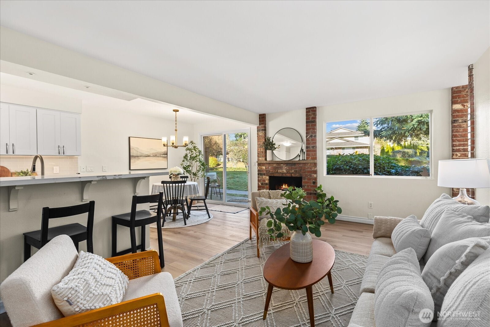 410 214th Street Southwest, Unit B Bothell, WA 98021 - Photo 9 of 37 a living room with furniture potted plant and a large window